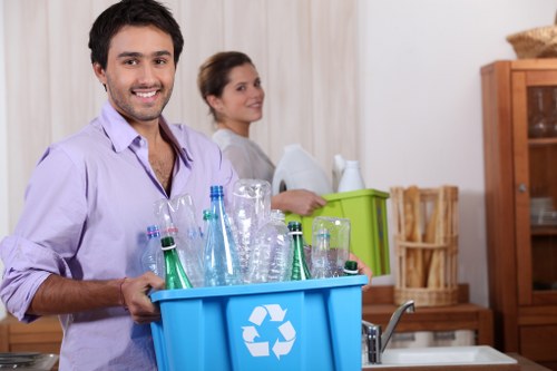 Workers sorting recyclables at a local transfer station